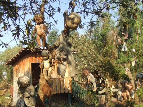 unexplained-events:  Don Julian was a hermit who lived in a shack located on the island. He claimed that the ghost of a young girl who drowned in the canal haunted him. To appease her angry spirit, Julian began collecting baby dolls and hanging them from