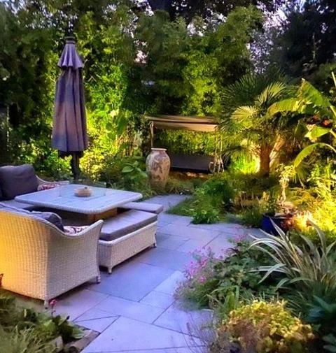 Pond Landscape In LondonDesign Ideas For A Mid-sized Tropical Full Sun Backyard Stone And Wood Fence