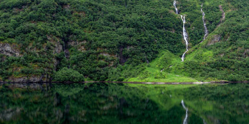 Green Fjord Reflections Reflections in the calm fjord outside Gudvangen, Norway.