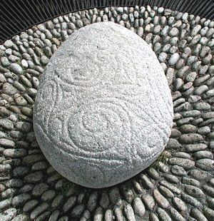 Castlestrange Stone: Along the side of the farm drive in the grounds of Castlestrange Demense stands this beautifully inscribed Cult stone, decorated with curvilinear ornament and dating to around 200 BC. The design is done in the Celtic La Tene style,