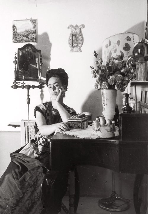 kafkasapartment:  Frida Kahlo sitting at her dressing table, 1945. Lola Alvarez Bravo. Gelatin silve