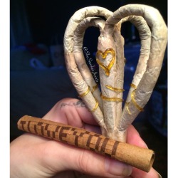 shesmokesjoints:  Two hearts, one joint ^_^ &lt;3 As I rolled my hunny this joint for Valentine’s Day, he wove me this “I Love You” blunt ^_^
