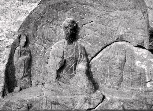 Another set of defaced Buddhas that have been there so long that they are gradually fading away; Loc