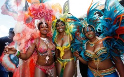 diasporicroots:  US actress Tatyana Ali (left) poses with her sisters Anastasia and Kimberly during their Butterflies, Beasts &amp; Bacchanal presentation on the final day of the Trinidad and Tobago Carnival at Queen’s Park Savannah in Port of Spain.