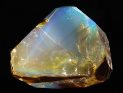 lonequixote:  Contra-Luz Opal This piece has a wonderful mix of facets, minerals, inclusions and color plays that combine to create surreal aquatic impression. 