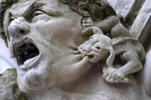firstofficerrose:  cerastes:mosertone:A small grotesque biting a bigger gargoyle, roof of Salisbury Cathedral, UK.     @petermorwood for Caturday, perhaps?