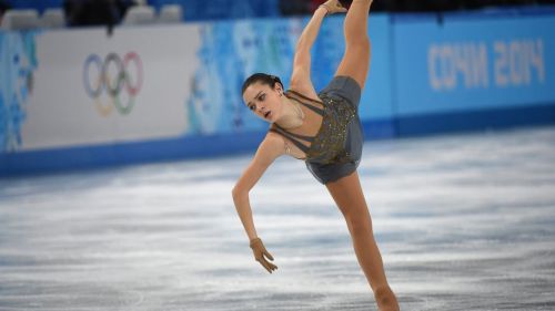 Adelina Sotnikova. Architectural gold blinging against a soft grey backdrop. One handed Beilmans. 