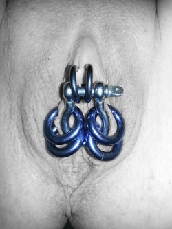 pussymodsgaloreInner labia piercings with rings which are linked by a shackle from the hardware store to create a chastity situation.An earlier poster comments: “Okay, that’s a rather neat little design. I wonder if it works as a practical “wear