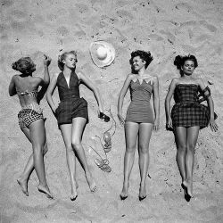 life:  From the May 15, 1950 cover story - “Beach Fashions: The Latest in One-Piece Suits.” According to the article, “The two-piece suit in general is running a poor second this summer.” (Nina Leen—The LIFE Picture Collection/Getty Images)
