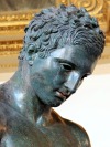 m1male2:The Approximate of Croatia, bronze statue, 2nd-1st centuries BC.  Apoxyomenos is one of the conventional subjects of Greek votive sculpture, depicting an athlete in the act of wiping sweat and dust from his body with the small curved instrument