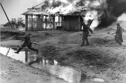 derpanzergraf: German infantry in a burning village on the Eastern Front.