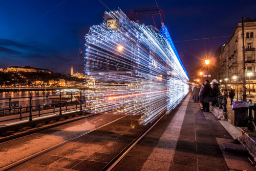 archiemcphee:  Each year during the Christmas season in Budapest, Hungary the city trams are each decorated with over 30,000 bright, twinkling LED lights.  “The tradition began in 2009 and has been a hit with passengers ever since. The lit up trams