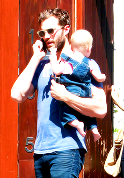 itsjamiedornan: Jamie Dornan with his wife and baby daughter in London.