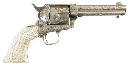 An engraved Colt Model 1873 Single Action Army with ivory grips.  Owned by a man named Timothy I. Co