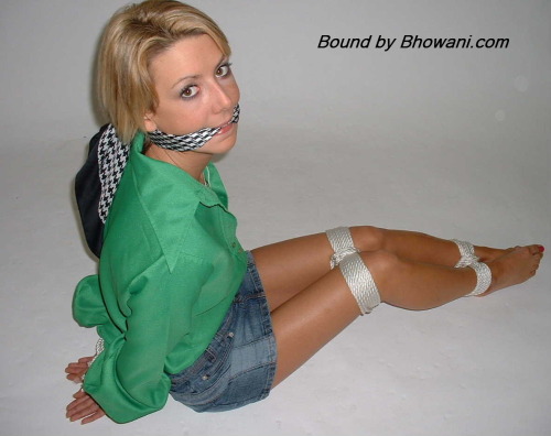 graybandanna:  Sabrina tied up in a green blouse with both a scarf cleave gag and a scarf over the nose gag