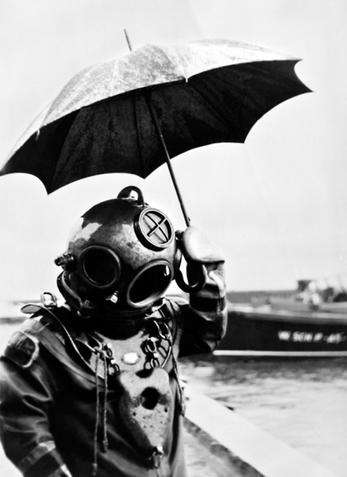 dropboxofcuriosities - Scuba diver with an umbrella, 1949.In...