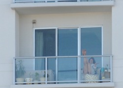 Just sitting way up on her balcony at the