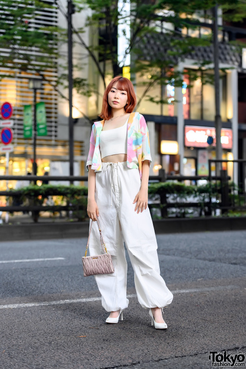 19-year-old Japanese model Uta on the street in Harajuku with an orange hairstyle, a cardigan over a