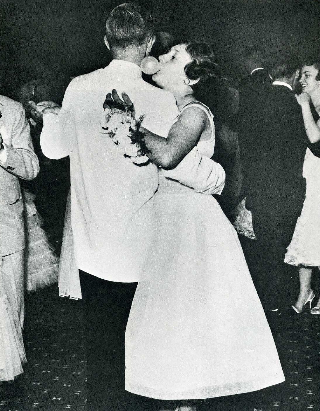 At her high school graduation prom, Suzie Spear of La Porte, Indiana, whispers sweet