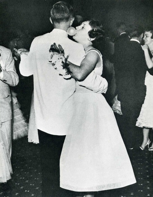 At her high school graduation prom, Suzie Spear of La Porte, Indiana, whispers sweet nothings in her partner’s ear.