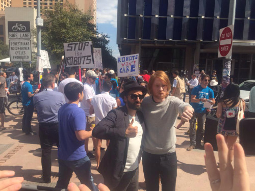 kylo:this picture of oscar and domhnall at an anti-a.i. protest is my single favorite image currentl