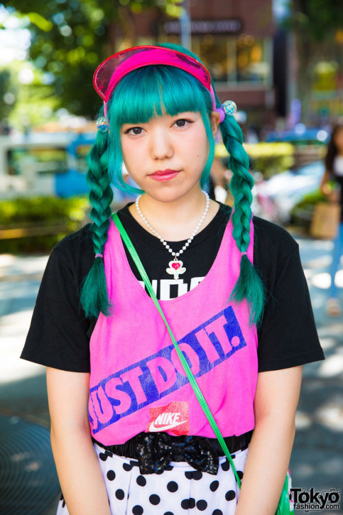 18-year-old Japanese fashion student Giovanni on the street in Harajuku wearing a colorful look that
