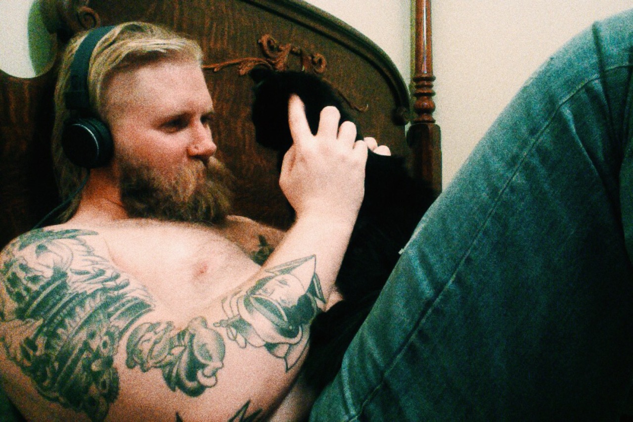 boyswithbeardswithcats:  Me and my lil smoke. I’m basically a cat bed.