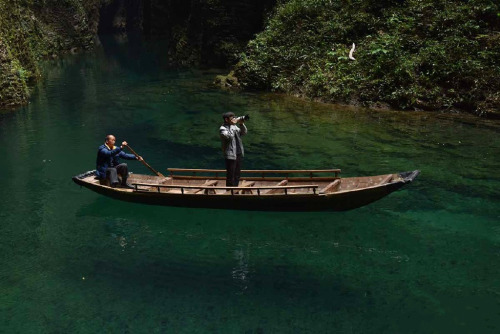 Valley in Ping Mountain屏山, Hefeng county鹤峰县, China. The water there is so clear that the boat is lik