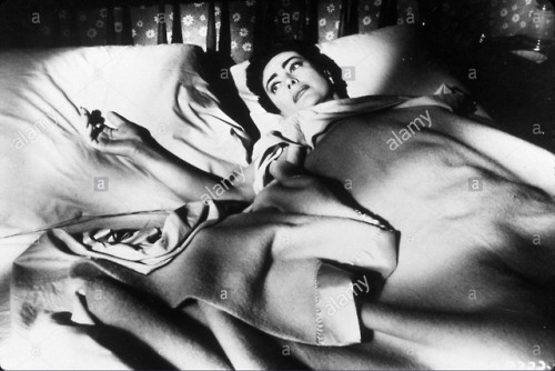 One third of our lives: Joan Crawford in bed.