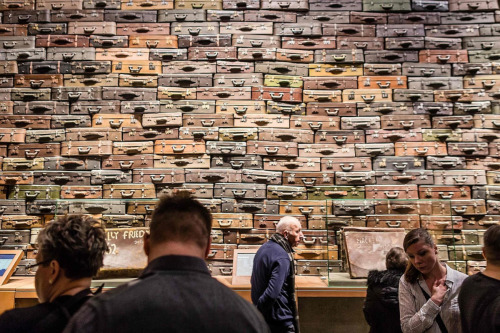 vintageeveryday: A wall of suitcases, symbolizing the deportation of Jews to death camps, forms part