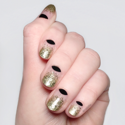 nailallie: My nails for New Year’s Eve! Decided to go with a gold glitter gradient and black h