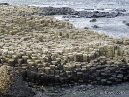 innerbohemienne:  The Giant’s Causeway in Antrim, Ireland is an area of about 40,000 interlocking basalt columns, the result of an ancient volcanic eruption about 50-60 million years ago. As the lava cooled, it contracted; the size of the columns is