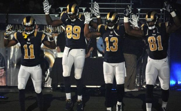kickoffcoverage:  Rams players enter field with “hands up, don’t shoot” salute