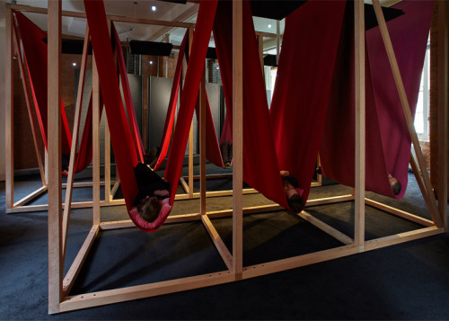 dezeen: Visitors to “London’s first sleeperie” can take a 10-minute nap in a colourful sling within 