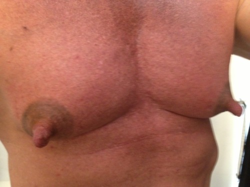 He is one very handsome man and with exceptional pecs and awesome nips!  WOOF