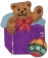 sticker of a brown bear waving from an opened purple gift box. there is a red, gold, and green ornament next to the box.