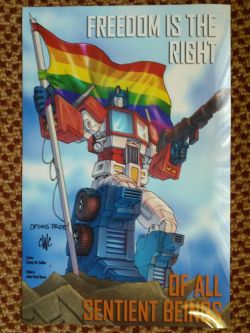 evilhasnever:  fierceawakening:  thealexicon:  Bought this print from Casey Coller over the weekend at Botcon. What a time to be alive  I saw that at the con and thought it was cute. Now… yeah. Yes.  OPTIMUS PRIDE THO