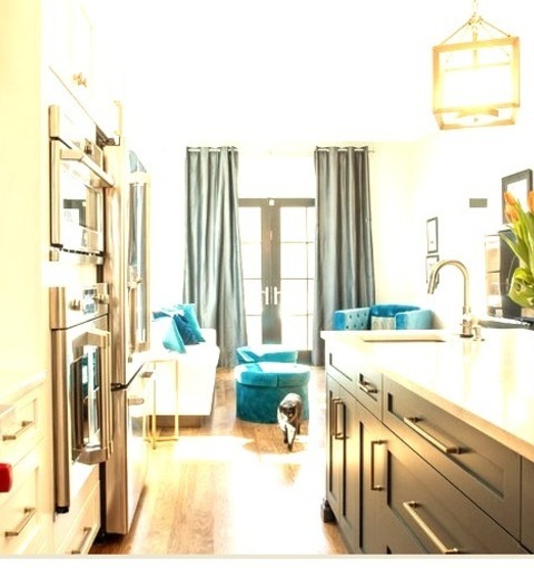 Kitchen PantryMid-sized Eclectic Galley Kitchen Pantry Idea With A Light Wood Floor And A Brown Floor,