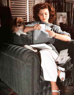 miss-shirley-temple:Shirley Temple as a teenager, at home opening fan mail with her dog, 1940s.