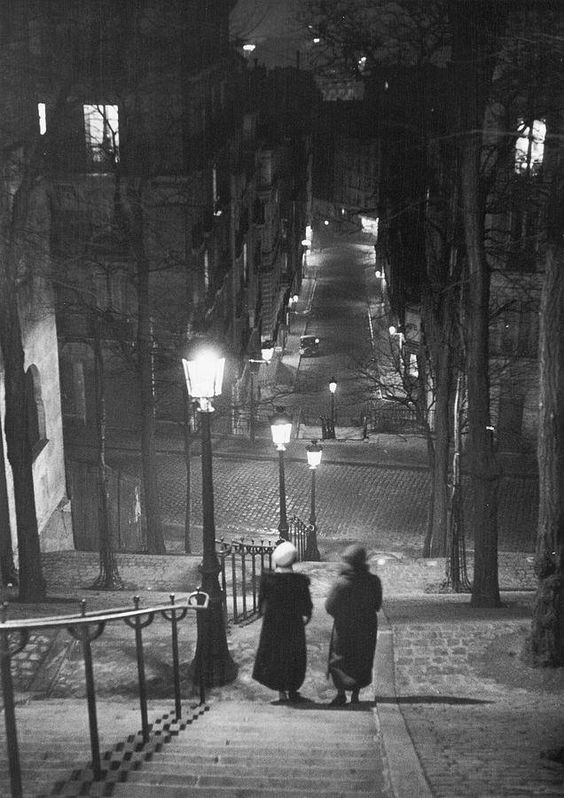  Pair of prostitutes descending stairs after dark in Montmartre, Paris, 1930. Photographed