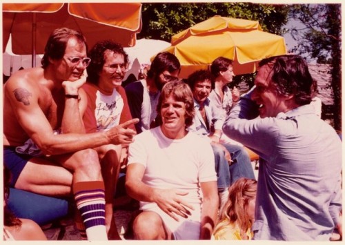 Captured roller skating and talking to friends, Hugh Hefner enjoys his 1979 Playboy Mansion Roller p