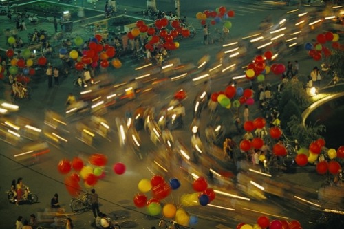 unrar - Motobikes race along a street during a Chinese New Year...