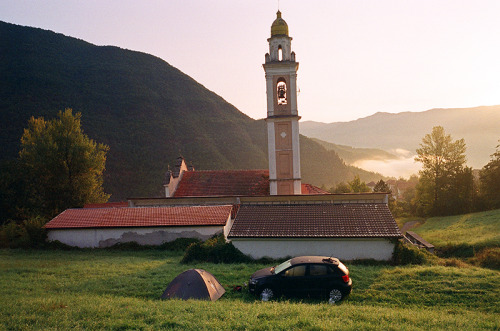 Sunrise camp spot behind a church in the mountains somewhere in Italy.