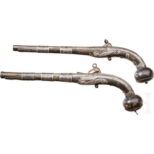 A pair of silver mounted miquelet pistols from the Caucasus, mid 19th century.from Hermann Historica
