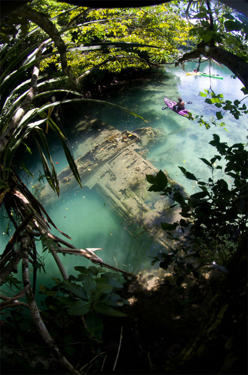ddaniell:  A Japanese warplane Second World War lies wrecked in shallow water off Guam in a photogra