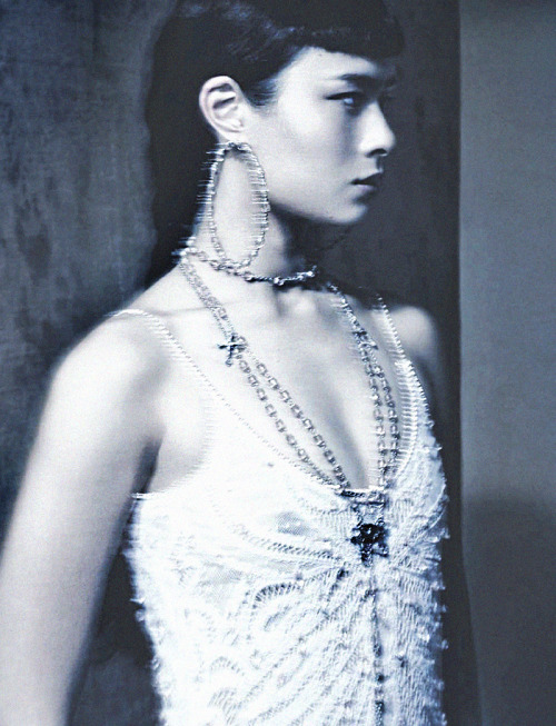 deprincessed:  Silent Movement: Musician and model Asia Chow wears a Givenchy Haute Couture patchwork dress embroidered heavily and decorated with countless translucent glass droplets and beads along with a rare silver-white metal jewellery to perfect