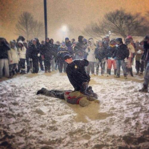 drag0n-spell:  A police officer was struck by a snowball in Boston during a huge public snowball fight.So naturally he tased a kid and pushed his face in the snow for several minutes, which caused a crowd to circle the officer in protest.This is a raw