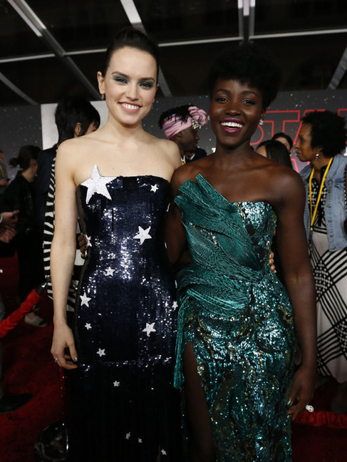 celebsofcolor:Lupita Nyong'o and Daisy Ridley attend the premiere of Disney Pictures and Lucasfilm’s