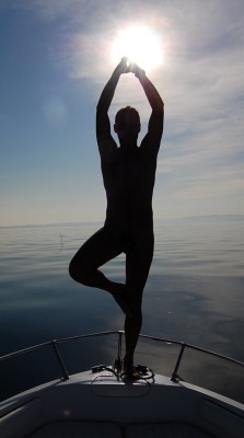 yogaformenonly:  Wow!  This photo is amazing!  I love the backdrop of the calm water, the beautiful asana and the sun at hands.   Thank you for sharing! Namaste 🙏