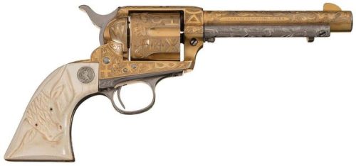 Gold plated and Cattle Brand engraved Colt Single Action Army with carved ivory grips. Manufactured 